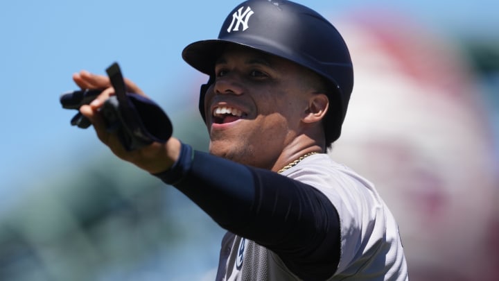 Jun 2, 2024; San Francisco, California, USA; New York Yankees right fielder Juan Soto (22) gestures after a bunt single against the San Francisco Giants during the fifth inning at Oracle Park. Mandatory Credit: Darren Yamashita-USA TODAY Sports