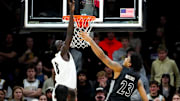 Jan 15, 2025; Boulder, Colorado, USA; Colorado Buffaloes forward Bangot Dak (8) blocks the shot of Cincinnati Bearcats forward Dillon Mitchell (23) in the second half at the CU Events Center. Mandatory Credit: Ron Chenoy-Imagn Images