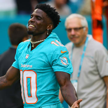 Miami Dolphins wide receiver Tyreek Hill (10) reacts as he walks on the field before the game against the Atlanta Falcons at Hard Rock Stadium.