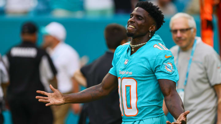 Miami Dolphins wide receiver Tyreek Hill (10) reacts as he walks on the field before the game against the Atlanta Falcons at Hard Rock Stadium.