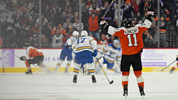 Nov 20, 2025; Philadelphia, Pennsylvania, USA; Philadelphia Flyers right wing Travis Konecny (11) celebrates game-winning goal in overtime by Philadelphia Flyers defenseman Travis Sanheim (6) against the St. Louis Blues at Xfinity Mobile Arena. Mandatory Credit: Eric Hartline-Imagn Images