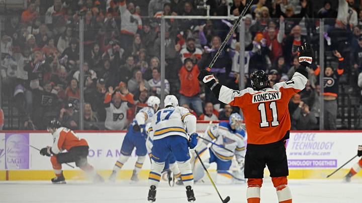 Nov 20, 2025; Philadelphia, Pennsylvania, USA; Philadelphia Flyers right wing Travis Konecny (11) celebrates game-winning goal in overtime by Philadelphia Flyers defenseman Travis Sanheim (6) against the St. Louis Blues at Xfinity Mobile Arena. Mandatory Credit: Eric Hartline-Imagn Images