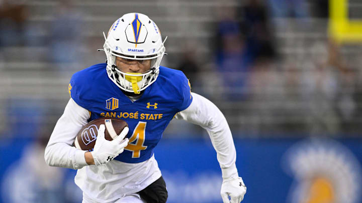 Nov 29, 2024; San Jose, California, USA; San Jose State Spartans wide receiver Matthew Coleman (14) runs the ball against the Stanford Cardinal in the fourth quarter at CEFCU Stadium. Mandatory Credit: Eakin Howard-Imagn Images Nov 29, 2024; San Jose, California, USA; San Jose State Spartans wide receiver Matthew Coleman (14) runs the ball against the Stanford Cardinal in the fourth quarter at CEFCU Stadium. Mandatory Credit: Eakin Howard-Imagn Images