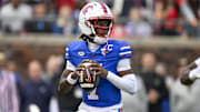 Nov 1, 2025; Dallas, Texas, USA;  SMU Mustangs quarterback Kevin Jennings (7) drops back to pass against the Miami Hurricanes during the second quarter at Gerald J. Ford Stadium. Mandatory Credit: Jerome Miron-Imagn Images