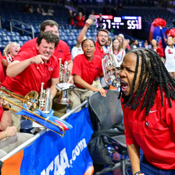 Mar 23, 2024; South Bend, Indiana, USA; Ole Miss Rebels head coach Yolett McPhee-McCuin celebrates with the Ole Miss band after defeating the Marquette Golden Eagles 67-55 in the first round of the NCAA Tournament at the Purcell Pavilion. Mandatory Credit: Matt Cashore-USA TODAY Sports