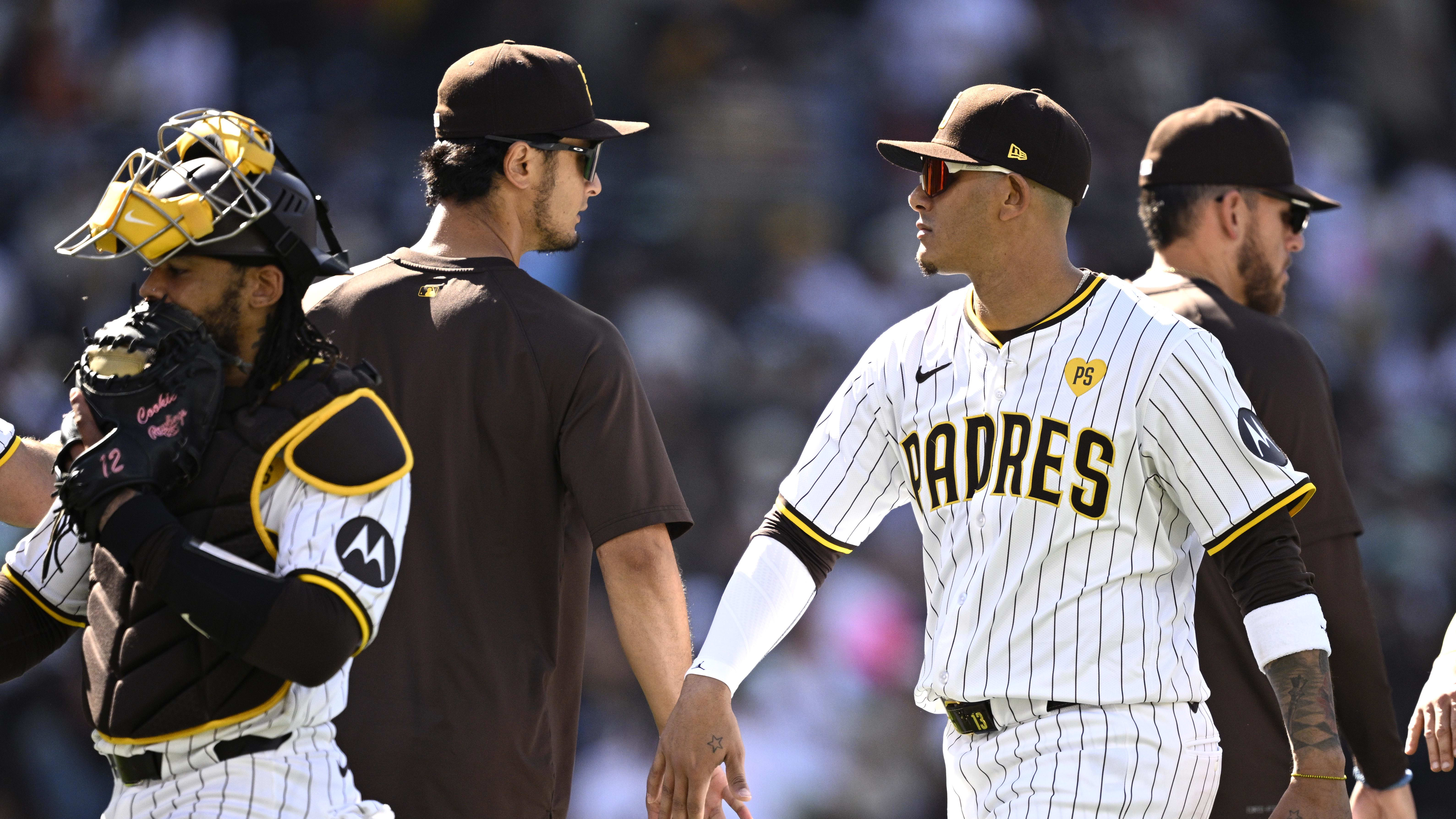 Apr 12, 2024; Baltimore, Maryland, USA; Milwaukee Brewers coach Rickie Weeks Jr. (center).