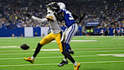 Sep 29, 2024; Indianapolis, Indiana, USA; Pittsburgh Steelers wide receiver George Pickens (14) misses a pass thanks to coverage from Indianapolis Colts cornerback Samuel Womack III (33) during the second half at Lucas Oil Stadium. Mandatory Credit: Marc Lebryk-Imagn Images