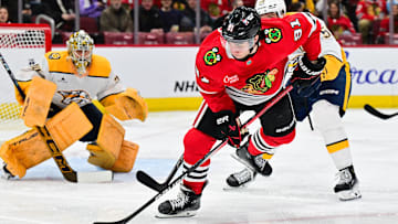 Feb 7, 2025; Chicago, Illinois, USA; Chicago Blackhawks center Frank Nazar (91) plays the puck against the Nashville Predators during the third period at the United Center. Mandatory Credit: Daniel Bartel-Imagn Images