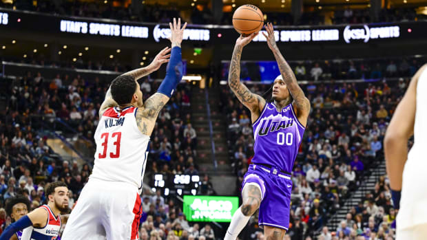 Mar 4, 2024; Salt Lake City, Utah, USA; Utah Jazz guard Jordan Clarkson (00) takes a jump shot over Washington Wizards forwar