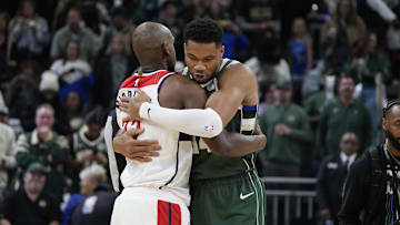 Oct 22, 2025; Milwaukee, Wisconsin, USA; Milwaukee Bucks forward Giannis Antetokounmpo (34) embraces Washington Wizards forward Khris Middleton (22) before their game at Fiserv Forum. It was Washington Wizards forward Khris Middleton (22) first return after being traded laster year. Mandatory Credit: Michael McLoone-Imagn Images