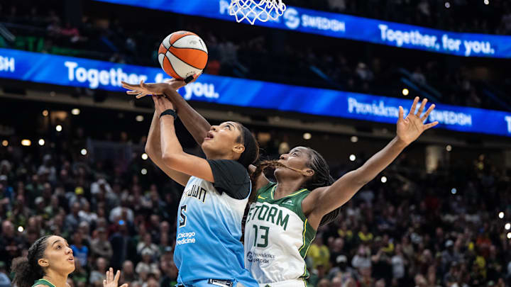 Aug 30, 2025; Seattle, Washington, USA; Chicago Sky forward Angel Reese (5) shoots the ball against Seattle Storm forward Ezi Magbegor (13) during the second half at Climate Pledge Arena. Mandatory Credit: Stephen Brashear-Imagn Images