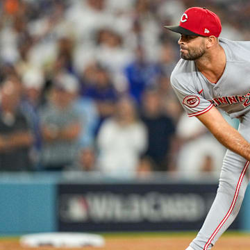 Cincinnati Reds starting pitcher Nick Martinez (28) throws a pitch in relief in the sixth inning of the MLB National League Wild Card Game 2 between the Los Angeles Dodgers and the Cincinnati Reds at Dodger Stadium in Los Angeles on Wednesday, Oct. 1, 2025. The Reds were eliminated from the postseason with an 8-4 loss to the reining World Series Champions La Dodgers.