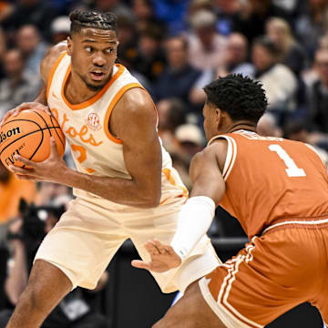 Mar 14, 2025; Nashville, TN, USA;  Tennessee Volunteers guard Chaz Lanier (2) looks over the defense as Texas Longhorns guard Julian Larry (1) defends during the second half at Bridgestone Arena. Mandatory Credit: Steve Roberts-Imagn Images