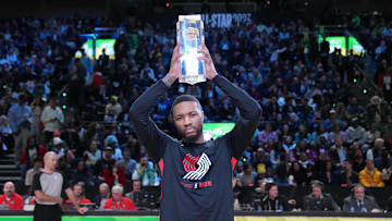 Feb 18, 2023; Salt Lake City, UT, USA; Portland Trail Blazers guard Damian Lillard (0) celebrates with the trophy after winning the 3-Point Contest during the 2023 All Star Saturday Night at Vivint Arena. Mandatory Credit: Kyle Terada-Imagn Images