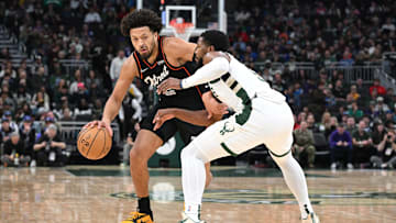 Nov 8, 2023; Milwaukee, Wisconsin, USA; Detroit Pistons guard Cade Cunningham (2) drives against Milwaukee Bucks guard Malik Beasley (5): Michael McLoone-Imagn Images
