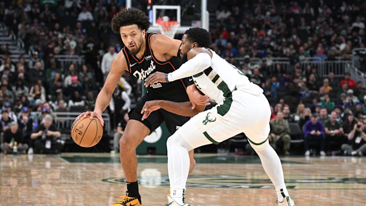 Nov 8, 2023; Milwaukee, Wisconsin, USA; Detroit Pistons guard Cade Cunningham (2) drives against Milwaukee Bucks guard Malik Beasley (5): Michael McLoone-Imagn Images