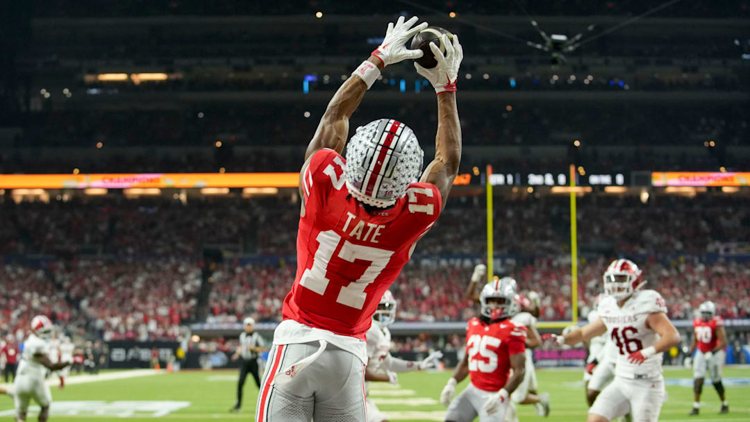 Ohio State Buckeyes wide receiver Carnell Tate (17) makes a catch for a touchdown Saturday, Dec. 6, 2025, during the Big Ten football championship against the Indiana Hoosiers at Lucas Oil Stadium in Indianapolis.
