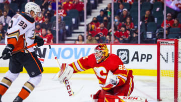 Feb 16, 2022; Calgary, Alberta, CAN; Calgary Flames goaltender Jacob Markstrom (25) makes a save as Anaheim Ducks right wing Jakob Silfverberg (33) tries to score during the second period at Scotiabank Saddledome. Mandatory Credit: Sergei Belski-USA TODAY Sports