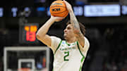 Mar 21, 2025; Seattle, WA, USA; Oregon Ducks guard Jadrian Tracey (2) shoots the ball against the Liberty Flames during the first half in the first round of the NCAA Tournament  at Climate Pledge Arena. Mandatory Credit: Stephen Brashear-Imagn Images
