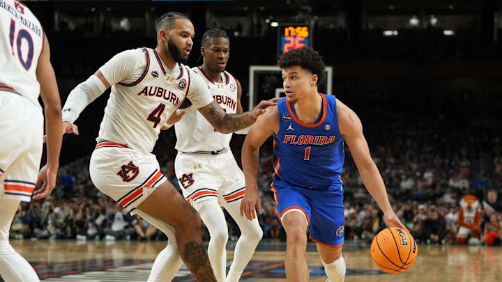 Florida Gators guard Walter Clayton Jr. dribbles the ball against Auburn Tigers forward Johni Broome during the second half in the semifinals of the men's Final Four of the 2025 NCAA Tournament at the Alamodome. Florida Gators guard Walter Clayton Jr. dribbles the ball against Auburn Tigers forward Johni Broome during the second half in the semifinals of the men's Final Four of the 2025 NCAA Tournament at the Alamodome.