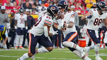 Aug 22, 2024; Kansas City, Missouri, USA; Chicago Bears quarterback Tyson Agent (17) hands off to running back Travis Homer (20) against the Kansas City Chiefs during the game at GEHA Field at Arrowhead Stadium. Mandatory Credit: Denny Medley-Imagn Images