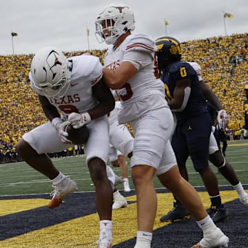 Sep 7, 2024; Ann Arbor, Michigan, USA; Texas Longhorns running back Jerrick Gibson (9) celebrates after scoring in the first half against the Michigan Wolverines at Michigan Stadium.