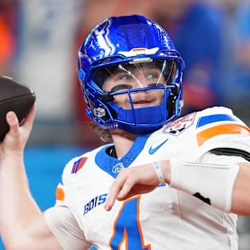 Boise State Broncos quarterback Maddux Madsen (4) practices before the Fiesta Bowl against the Penn State Nittany Lions at State Farm Stadium. 