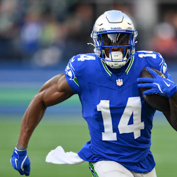 Oct 10, 2024; Seattle, Washington, USA; Seattle Seahawks wide receiver DK Metcalf (14) carries the ball after a catch during the first half against the San Francisco 49ers at Lumen Field. Mandatory Credit: Steven Bisig-Imagn Images