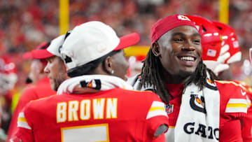 Aug 22, 2025; Kansas City, Missouri, USA; Kansas City Chiefs wide receiver Hollywood Brown (5) and wide receiver Rashee Rice (4) laugh on the sidelines against the Chicago Bears during the game at GEHA Field at Arrowhead Stadium. Mandatory Credit: Denny Medley-Imagn Images