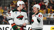 Apr 22, 2025; Las Vegas, Nevada, USA; Minnesota Wild left wing Matt Boldy (12) talks to Minnesota Wild left wing Kirill Kaprizov (97) before a face off against the Vegas Golden Knights during the second period of game two of the first round of the 2025 Stanley Cup Playoffs at T-Mobile Arena. Mandatory Credit: Stephen R. Sylvanie-Imagn Images