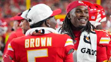 Kansas City Chiefs wide receiver Hollywood Brown (5) and wide receiver Rashee Rice (4) laugh on the sidelines against the Chicago Bears during the game at GEHA Field at Arrowhead Stadium.