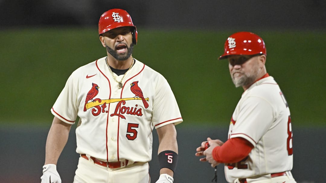Oct 8, 2022; St. Louis, Missouri, USA; St. Louis Cardinals designated hitter Albert Pujols (5) reacts after his single in the eighth inning against the Philadelphia Phillies during game two of the Wild Card series for the 2022 MLB Playoffs at Busch Stadium. Mandatory Credit: Jeff Curry-Imagn Images