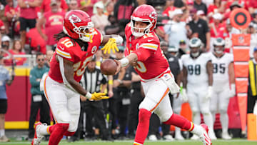 Sep 14, 2025; Kansas City, Missouri, USA; Kansas City Chiefs quarterback Patrick Mahomes (15) hands the ball to running back Isiah Pacheco (10) against the Philadelphia Eagles during the third quarter of the game at GEHA Field at Arrowhead Stadium. Mandatory Credit: Denny Medley-Imagn Images