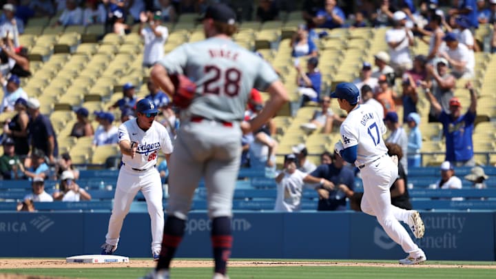 Sep 8, 2024; Los Angeles, California, USA;  Los Angeles Dodgers designated hitter Shohei Ohtani (17) hits a home run off Cleveland Guardians starting pitcher Tanner Bibee (28) during the fifth inning of a MLB baseball game at Dodger Stadium. Mandatory Credit: Kiyoshi Mio-Imagn Images