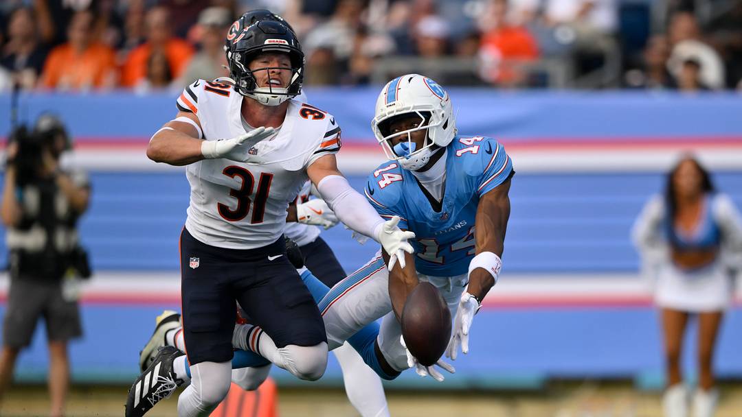 Aug 29, 2026; Nashville, Tennessee, USA;  Chicago Bears safety Dillon Thieneman (31) breaks up a pass intended for Tennessee Titans wide receiver Carnell Tate (14) in the first quarter at Nissan Stadium.  Mandatory Credit: Steve Roberts-Imagn Images