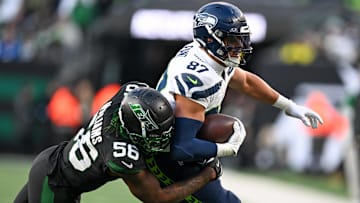 Seattle Seahawks tight end Noah Fant (87) runs with the ball during the third quarter and is tackled by New York Jets linebacker Quincy Williams (56) at MetLife Stadium. 