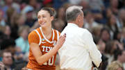 Apr 4, 2025; Tampa, FL, USA;  Texas Longhorns guard Shay Holle (10) and head coach Vic Schaefer during the semifinal of the women's 2025 NCAA tournament against the South Carolina Gamecocks at Amalie Arena. Mandatory Credit: Kirby Lee-Imagn Images