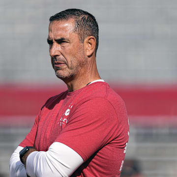 Sep 20, 2025; Madison, Wisconsin, USA;  Wisconsin Badgers head coach Luke Fickell looks on during warm-ups prior to the game against the Maryland Terrapins at Camp Randall Stadium.