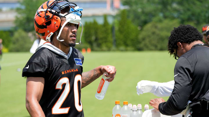 Cincinnati Bengals cornerback DJ Turner II (20) grabs a water at Bengals practice, Tuesday, June 4, 2024, in Cincinnati.