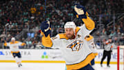 Nov 2, 2023; Seattle, Washington, USA; Nashville Predators center Ryan O'Reilly (90) celebrates a goal scored by defenseman Roman Josi (not pictured) during the second period at Climate Pledge Arena. Mandatory Credit: Steven Bisig-USA TODAY Sports