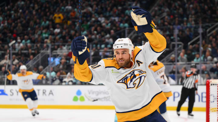 Nov 2, 2023; Seattle, Washington, USA; Nashville Predators center Ryan O'Reilly (90) celebrates a goal scored by defenseman Roman Josi (not pictured) during the second period at Climate Pledge Arena. Mandatory Credit: Steven Bisig-USA TODAY Sports