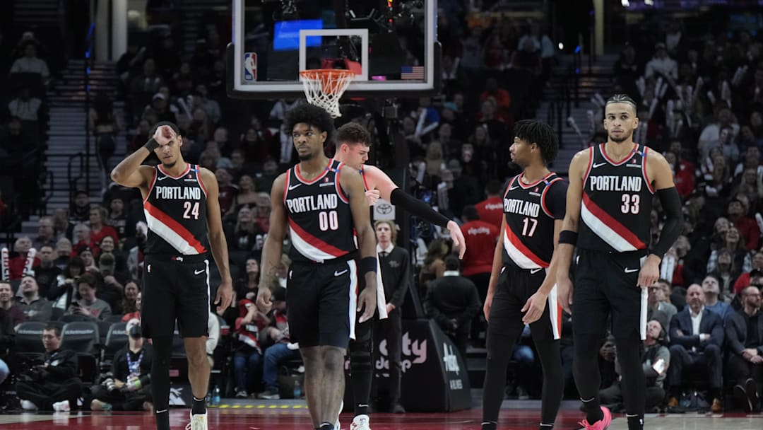 Jan 14, 2025; Portland, Oregon, USA; Portland Trail Blazers (from left to right) Kris Murray (24), Scoot Henderson (00), Donovan Clingan (23),  Shaedon Sharpe (17) and Toumani Camara (33) walk back to the court after a timeout during the second half against the Brooklyn Nets at Moda Center. Mandatory Credit: Soobum Im-Imagn Images