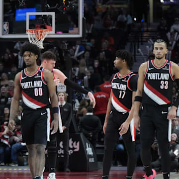 Jan 14, 2025; Portland, Oregon, USA; Portland Trail Blazers (from left to right) Kris Murray (24), Scoot Henderson (00), Donovan Clingan (23),  Shaedon Sharpe (17) and Toumani Camara (33) walk back to the court after a timeout during the second half against the Brooklyn Nets at Moda Center. Mandatory Credit: Soobum Im-Imagn Images