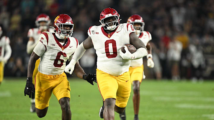 Sep 13, 2025; West Lafayette, Indiana, USA;  USC Trojans defensive tackle Jamaal Jarrett (0) runs the ball in for a touchdown after intercepting it during the second half against the Purdue Boilermakers at Ross-Ade Stadium. Mandatory Credit: Marc Lebryk-Imagn Images