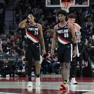 Jan 14, 2025; Portland, Oregon, USA; Portland Trail Blazers (from left to right) Kris Murray (24), Scoot Henderson (00), Donovan Clingan (23),  Shaedon Sharpe (17) and Toumani Camara (33) walk back to the court after a timeout during the second half against the Brooklyn Nets at Moda Center. Mandatory Credit: Soobum Im-Imagn Images