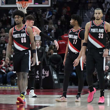 Jan 14, 2025; Portland, Oregon, USA; Portland Trail Blazers (from left to right) Kris Murray (24), Scoot Henderson (00), Donovan Clingan (23),  Shaedon Sharpe (17) and Toumani Camara (33) walk back to the court after a timeout during the second half against the Brooklyn Nets at Moda Center. Mandatory Credit: Soobum Im-Imagn Images