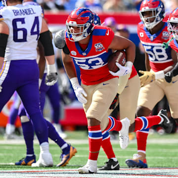 Sep 8, 2024; East Rutherford, New Jersey, USA; New York Giants linebacker Darius Muasau (53) reacts after an interception against the Minnesota Vikings during the second half at MetLife Stadium.  