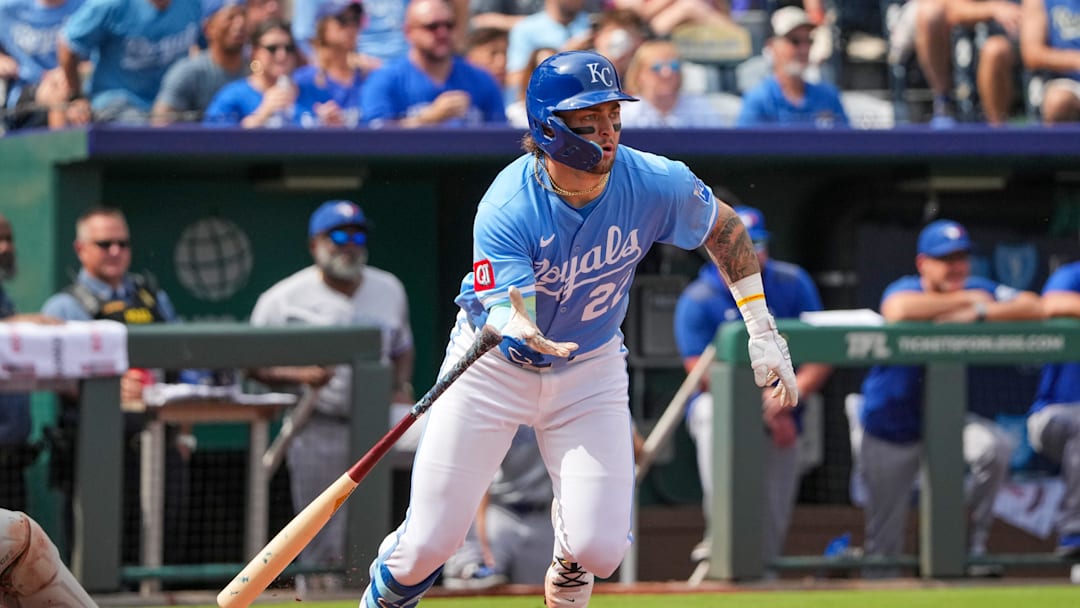 Sep 21, 2025; Kansas City, Missouri, USA; Kansas City Royals catcher Carter Jensen (22) hits a two run single against the Toronto Blue Jays during the fourth inning at Kauffman Stadium. Mandatory Credit: Denny Medley-Imagn Images