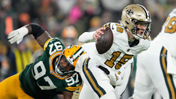 New Orleans Saints quarterback Spencer Rattler tries to avoid a sack in the Saints' 34-0 loss at Green Bay Monday night to fall to 5-10 on the season.