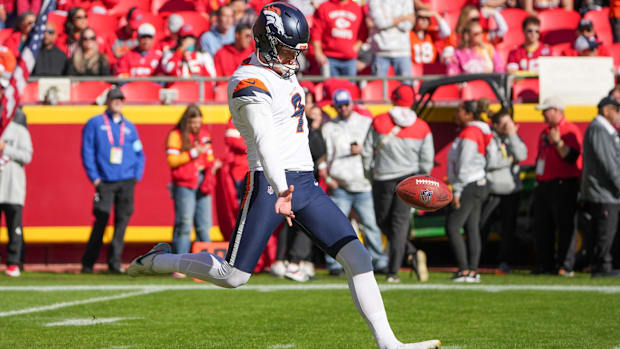 Denver Broncos punter Riley Dixon (9) warms up against the Kansas City Chiefs.
